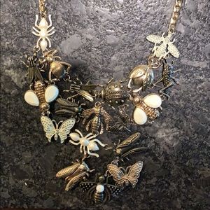 Bib necklace featuring several different insects.